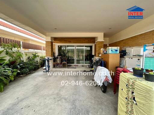 Garage area with storage and plants