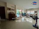 Spacious living room with modern furniture and sliding glass doors to the patio