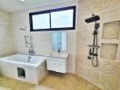 Modern bathroom with bathtub, shower, and sink