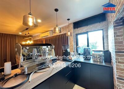 Modern kitchen with coffee machines and pendant lights