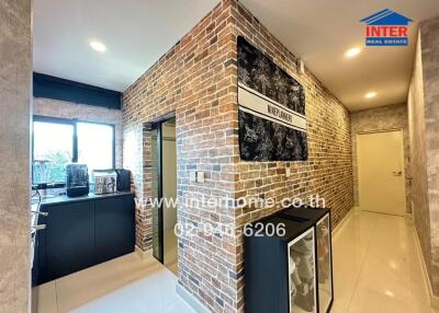 Modern kitchen with brick walls and sleek cabinetry