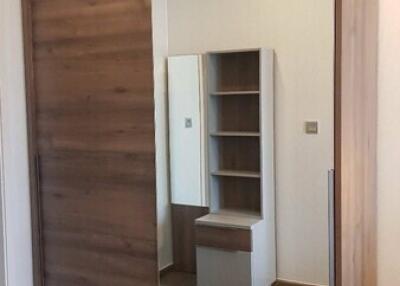 Bedroom with wooden wardrobe and mirror