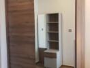 Bedroom with wooden wardrobe and mirror