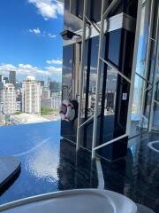 Outdoor infinity pool with city skyline view