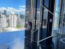 Outdoor infinity pool with city skyline view