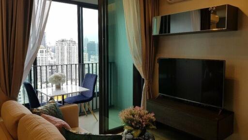 Modern living room with a city view and a balcony