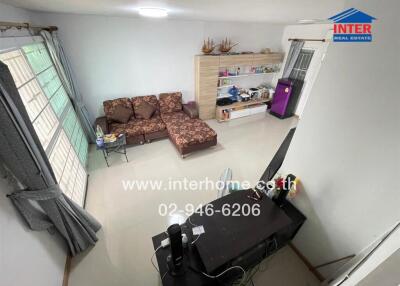 Spacious living room with a sectional sofa, modern interior and entertainment unit