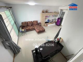 Spacious living room with a sectional sofa, modern interior and entertainment unit