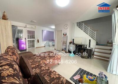 Living room with furniture and staircase