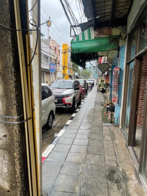 Street view with cars and sidewalk