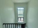 Bright and clean staircase with large window