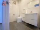 Modern bathroom with white fixtures and gray tile floor