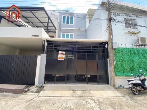 Exterior view of the house with garage and surrounding area