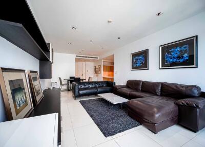 Modern living room with leather sofas and wall art