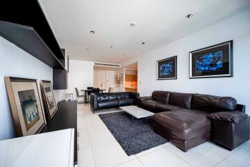 Modern living room with leather sofas and wall art