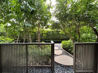 View of a garden pathway with stepping stones and lush greenery