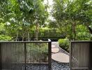 View of a garden pathway with stepping stones and lush greenery