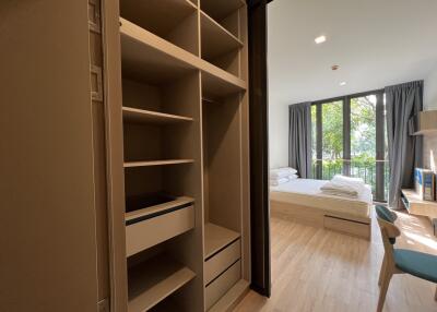 Modern bedroom with large windows and natural light