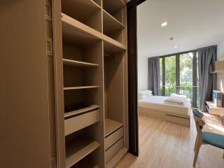 Modern bedroom with large windows and natural light