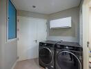 Modern laundry room with washer and dryer