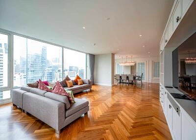 Modern living room with large windows and city view