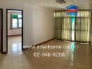 Main living space with glass door and tiled floor