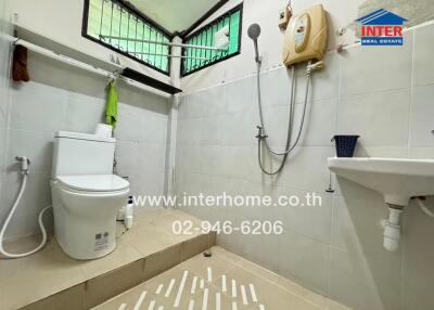 Bathroom with shower, toilet, and sink