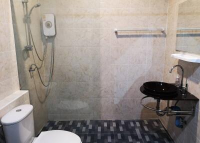 Modern bathroom with shower and black sink