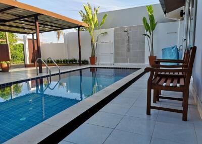 Outdoor area with swimming pool and seating area