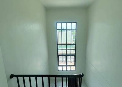 Modern staircase with large window