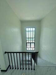 Modern staircase with large window