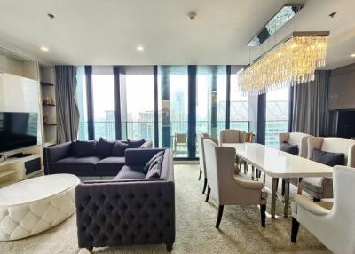 Modern living and dining area with city view