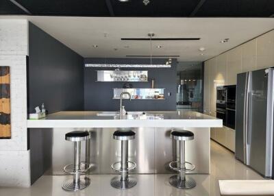 Modern kitchen with a sleek design and stainless steel appliances