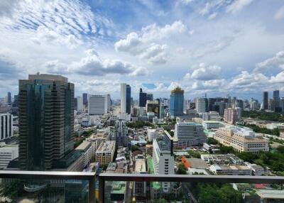 City skyline view from a high-rise building balcony