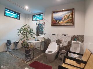 Modern bathroom with decorative elements and indoor plants