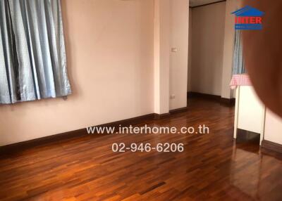 Unfurnished bedroom with hardwood floors