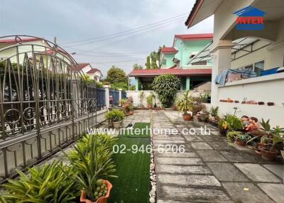 garden with potted plants and patio