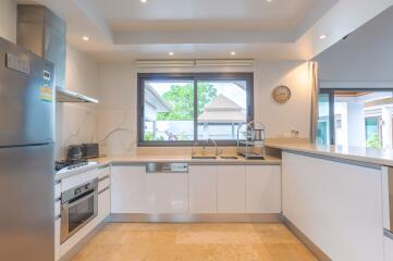 Modern kitchen with appliances and large window