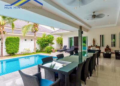 Outdoor dining area with pool