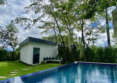 backyard with pool and guest house