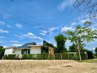 Two-story modern house with a large yard