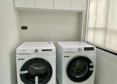 Modern laundry room with Samsung washer and dryer