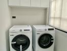 Modern laundry room with Samsung washer and dryer