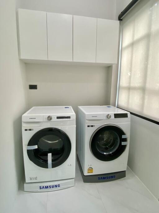 Modern laundry room with Samsung washer and dryer