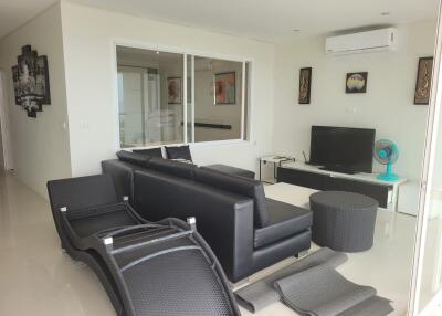 Modern living room with black furniture and air conditioning