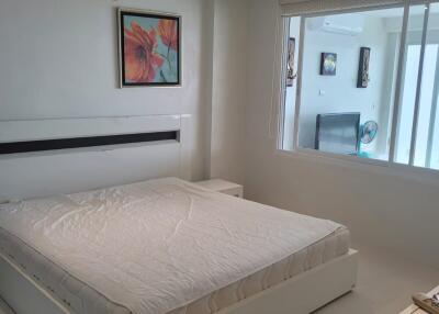 Modern bedroom with a large bed and air conditioning