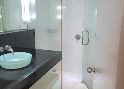 Modern bathroom with glass shower and vessel sink