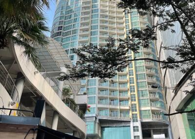 High-rise residential building with glass facade and balconies