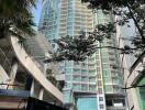 High-rise residential building with glass facade and balconies