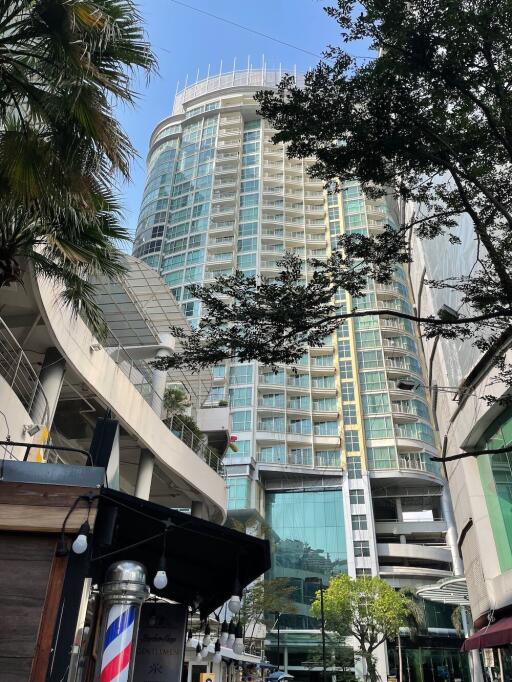 High-rise residential building with glass facade and balconies